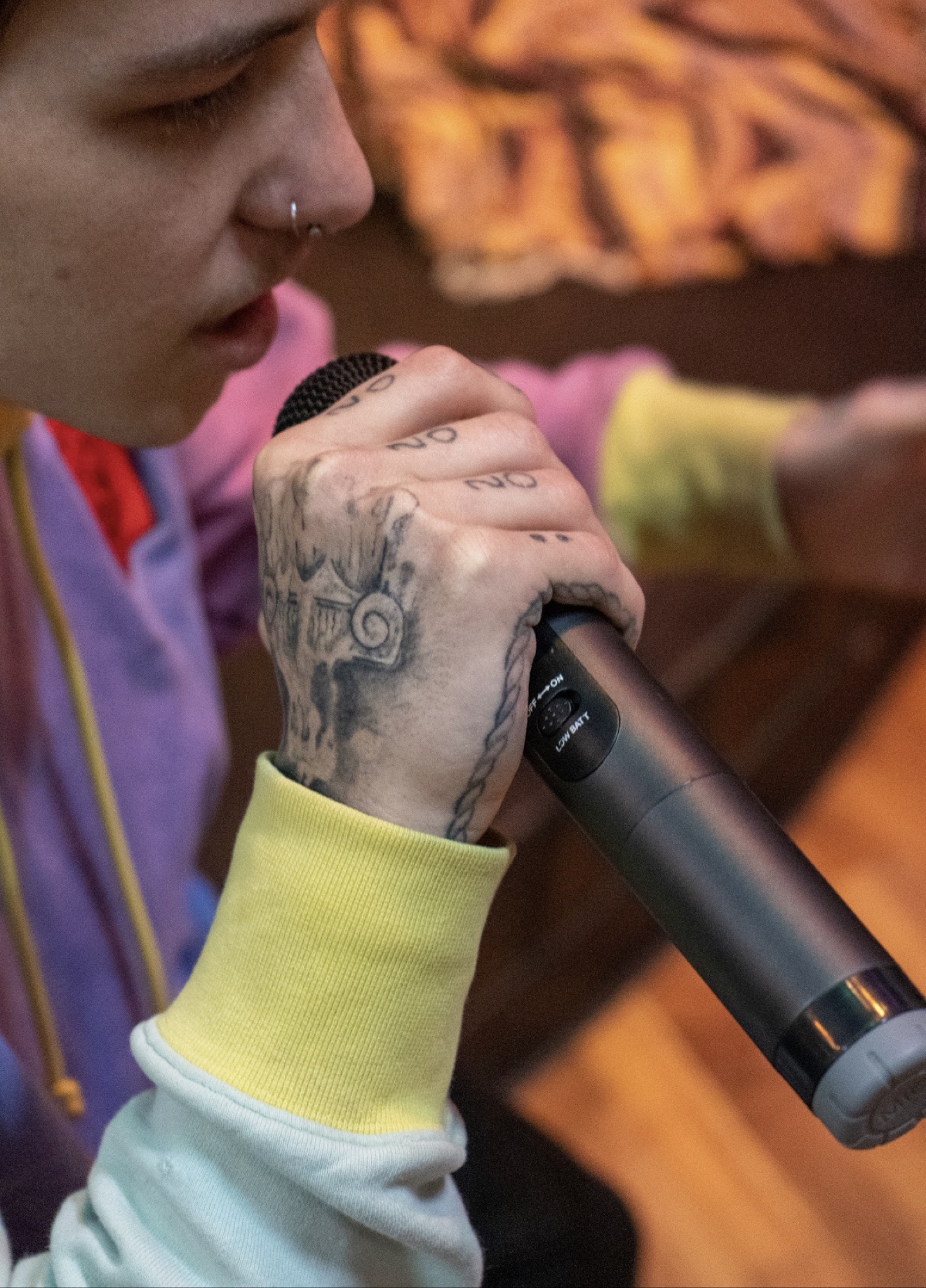 Zaden Z performing with a microphone